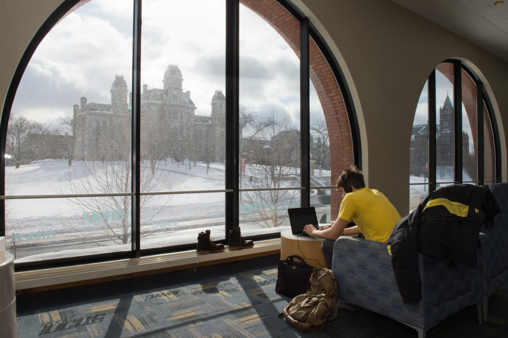 Liberal Arts - Student Reading in the Hall Languages