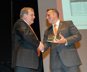 Mike Frasciello presents Charters’ son Alexander William Charters with an award