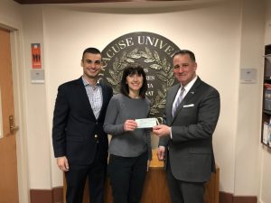 Ben Vasquez ’18 and his mother Sandra Vasquez present a check to Dean Michael Frasciello. The Vasquez family created a scholarship for part-time students studying in a mental health related field in honor of Vasquez’s sister.