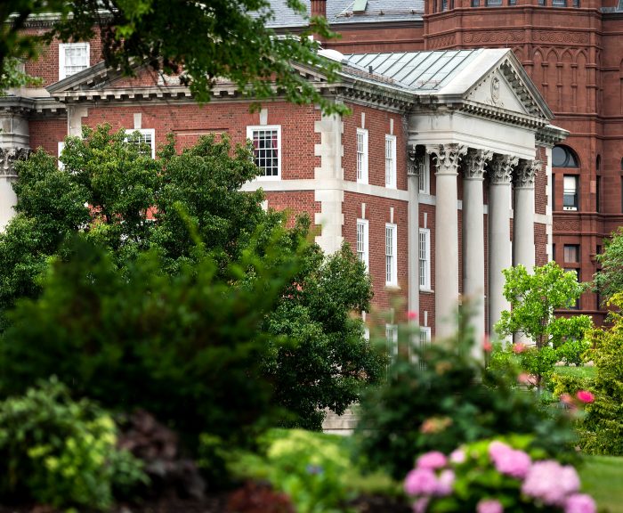 Landscaping reveals a view of Maxwell School of Citizenship and Public Affairs.