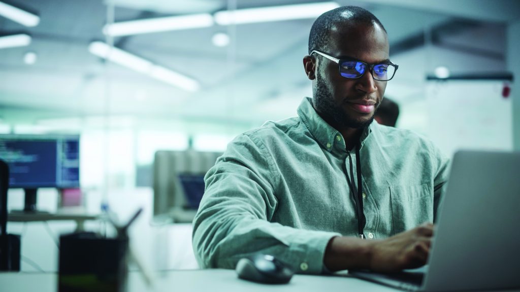 Photo of motivated black IT professional