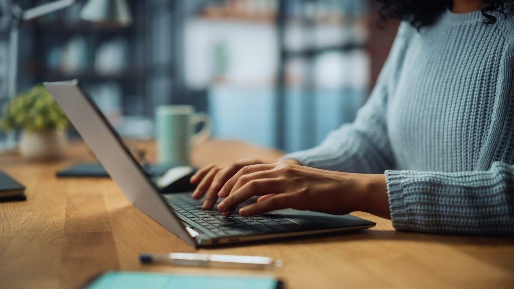 woman on laptop typing