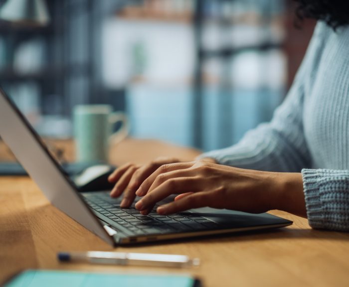 woman on laptop typing