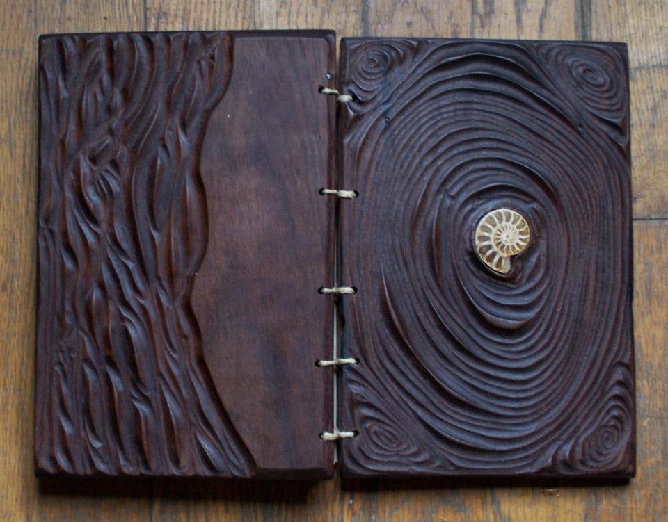 Wood carved and bound. Art by Robert Salvato
