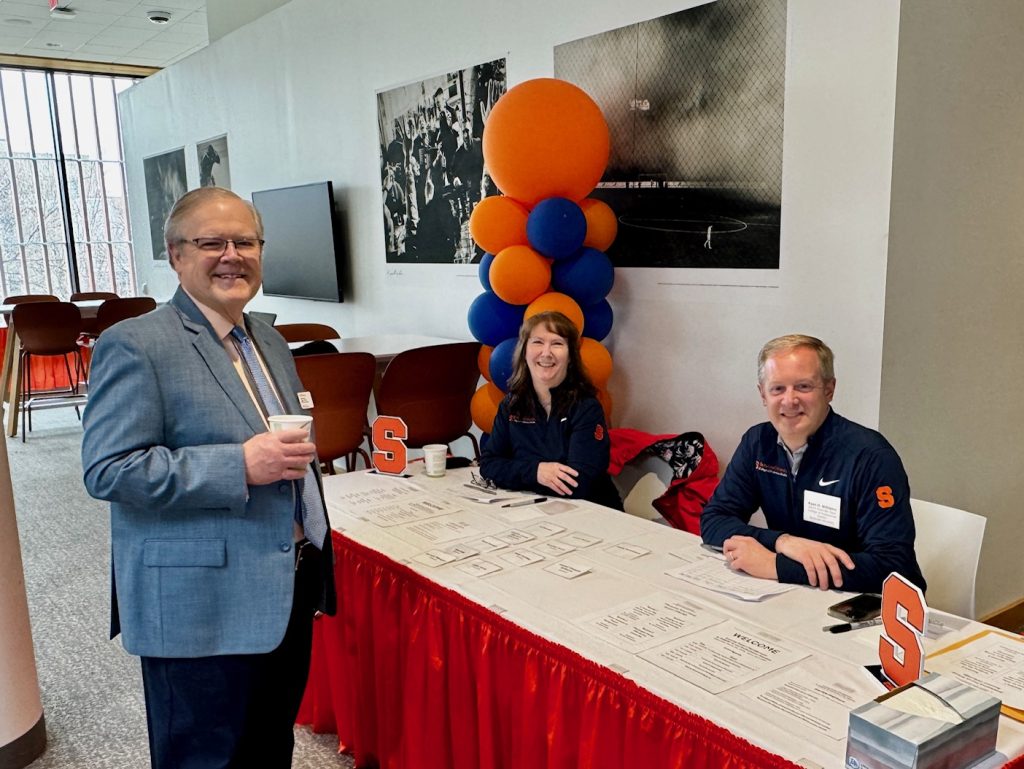 Registration table with Andrea Willis. Associate Dean Ryan O. Williams and Dr. Arthur Thomas