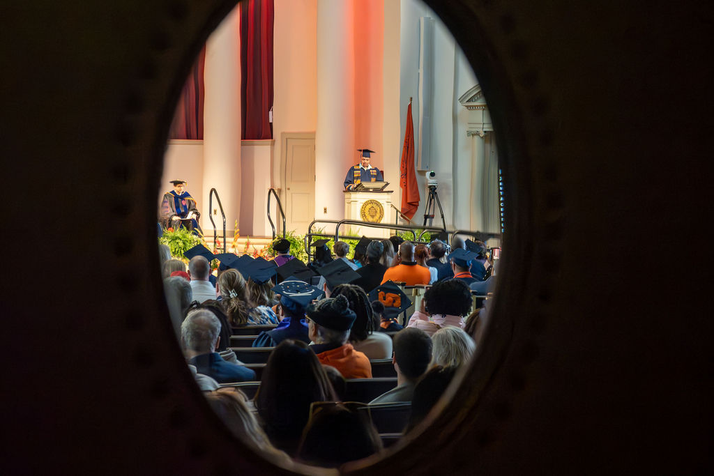 Shayne Turo speaks at the 2026 College of Professional Studies convocation.