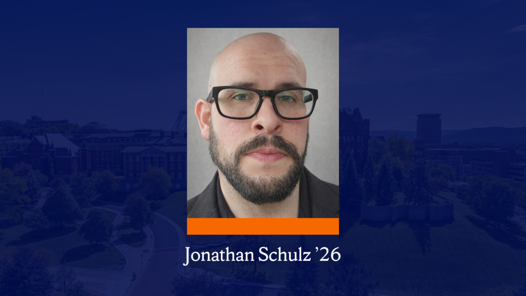 A headshot of a person with rectangle glasses and a beard. Below it is an aerial photo of campus buildings and trees with a dark blue overlay. Below the headshot is an orange rectangle and text that reads "Jonathan Schulz ’26."